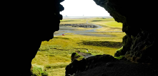 istock Vík, Iceland: Distant View, Reynisdrangar Sea Cliffs and Black Beach 1190496395