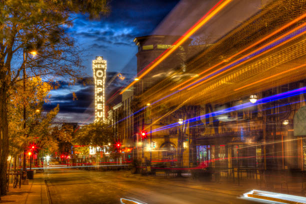 State Street in Madison Wisconsin Madison, Wisconsin, USA - October 16, 2019: Lights from a city bus bring a burst of color to State Street in Madison, Wisconsin. madison wisconsin photos stock pictures, royalty-free photos & images