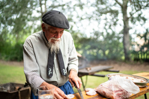 istock Gaucho cutting beef for asado (argentinian barbecue) 1190498525