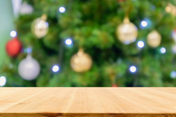 istock Empty wood table top with Abstract blur Christmas tree with decoration bokeh light background for product display 1190508938