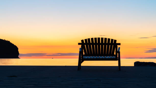 Sunrise Spot Sunrise with a bench, Door County, WI, USA lake michigan stock pictures, royalty-free photos & images