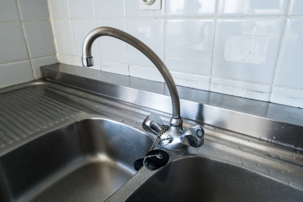 istock kitchen faucet on a stainless steel sink 1190510813