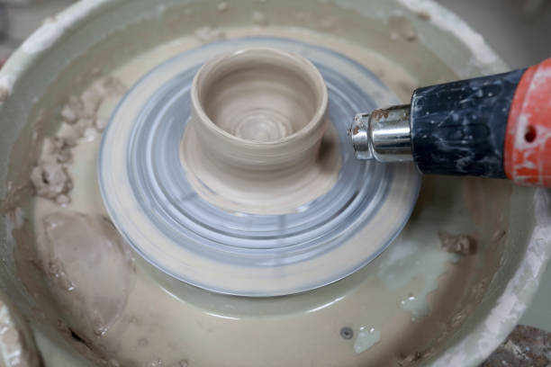 istock Person drying cup on pottery wheel 1190512024