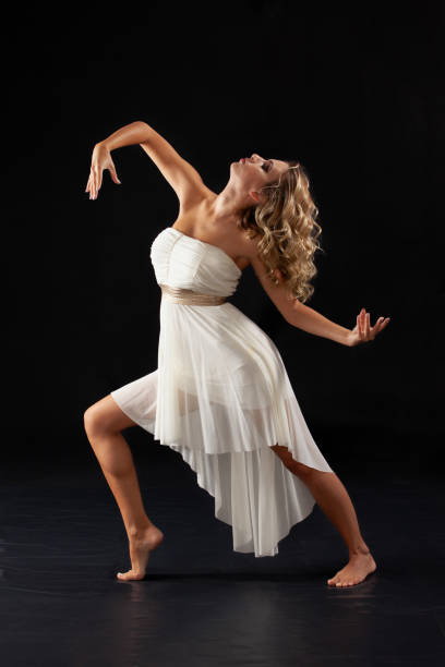 modern ballet dancer performing movement stock photo