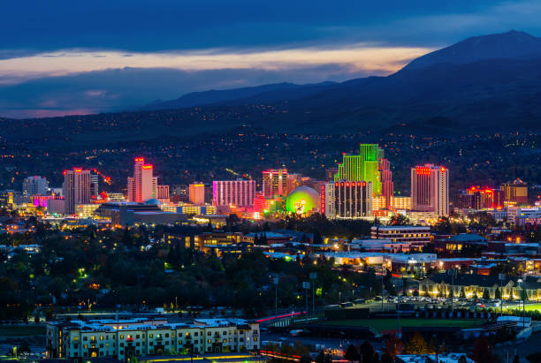 Reno skyline at night RENO - OCTOBER 30, 2014: Reno skyline on October 30, 2014. It's known as The Biggest Little City in the World, famous for casinos and the birthplace of the gaming Harrah's Entertainment. game resort pictures stock pictures, royalty-free photos & images