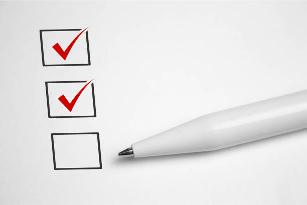 istock Checklist concept - checklist box with red checkmark, paper and a pen with checklist. 1190518340