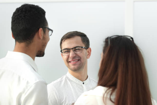 istock close up. business colleagues standing in a bright office 1190520558