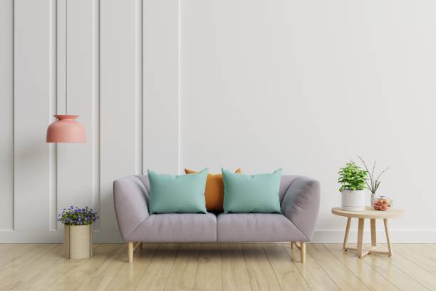 istock Modern living room interior with sofa and plants,lamp,table on white wall background. 1190520566