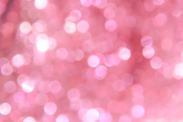 istock White bokeh sparkle glitter abstract patterns on sweet pink background 1190526230