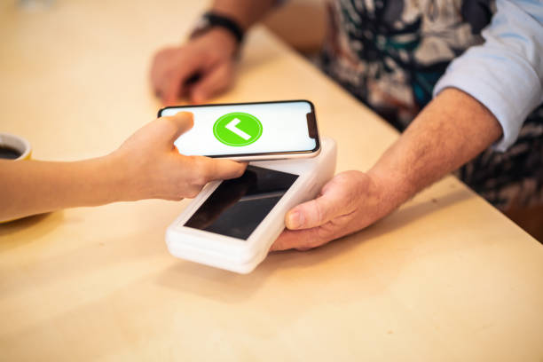 istock Mobile payment in a coffee shop 1190530366