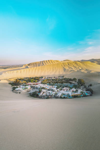 Remote located in the deserts of Peru, humans have settled down in this small oasis called Huacachina. Seen at day in the summer.