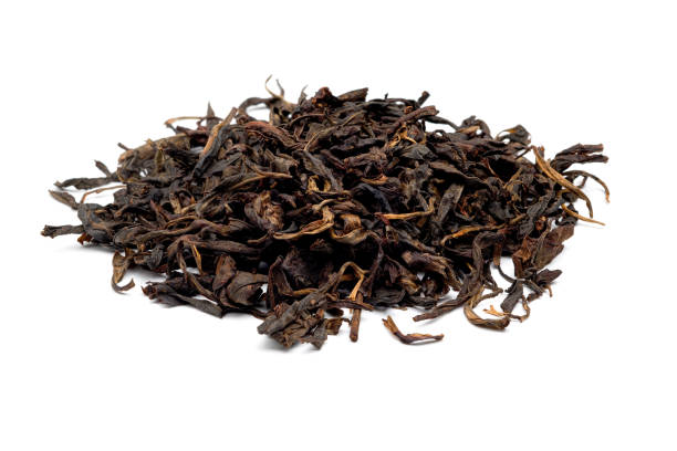 istock Dried fermented tea leaves stacked isolated on a white background. 1190530653