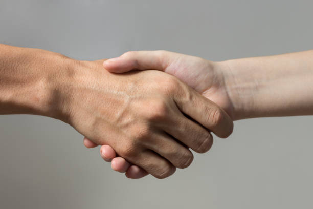istock Handshake closeup. Peace, support, success, equality or togetherness concept 1190532268