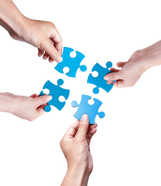 istock Puzzle Pieces Coming Together isolated on white background 1190538114