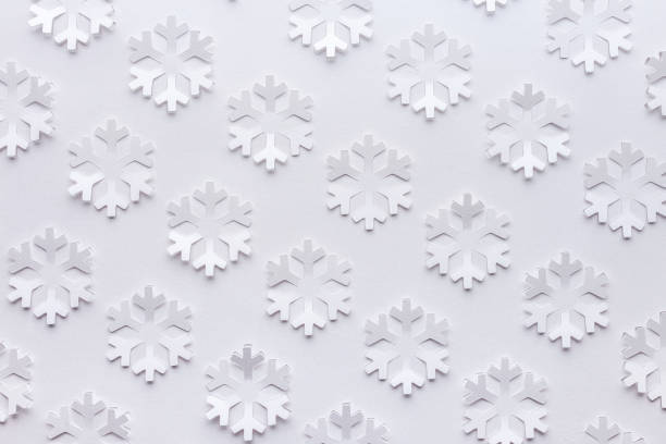 snowflakes cut out on a sheet of paper