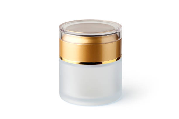 Empty cosmetic glass jar with golden lid