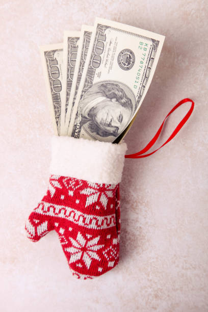 istock Money in a Christmas glov 1190551701