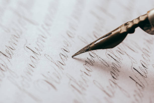 istock fountain pen on paper with ink text closeup 1190552676