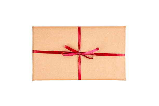 istock Gift Boxes in Craft Wrapping Paper with Red Ribbons isolated 1190554116