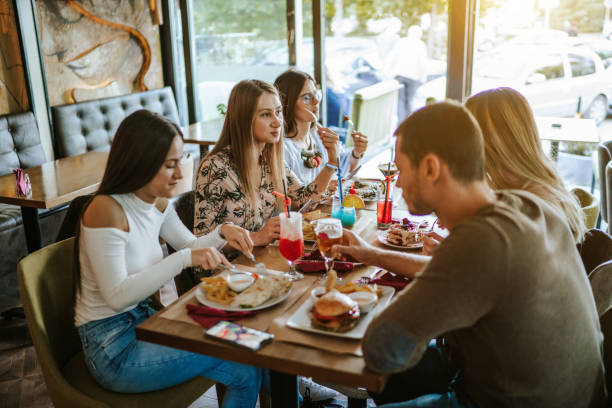 istock Cheerful friends at restaurant 1190556797
