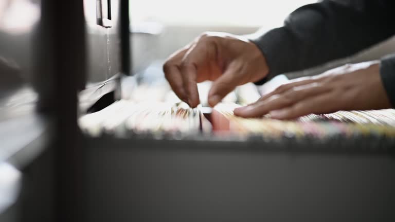 An employee searching for documents in a file cabinet