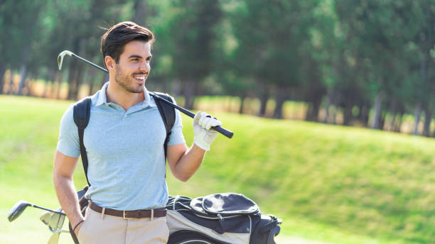 istock Male golfer standing on golf course 1190556982