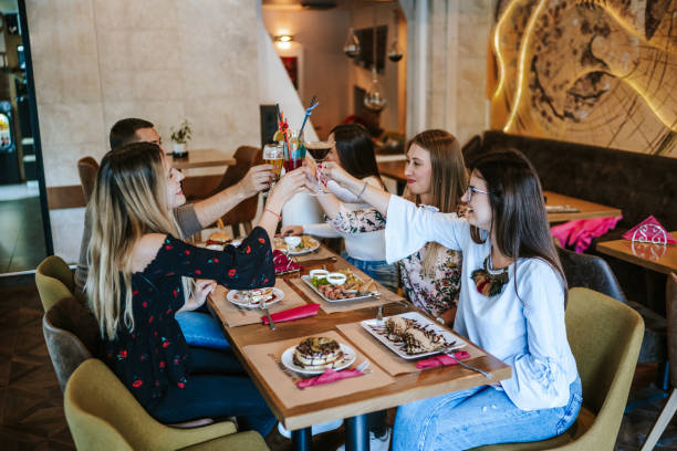 istock Cheerful friends at restaurant 1190557132