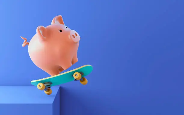 Photo of Pink piggy bank on a skateboard