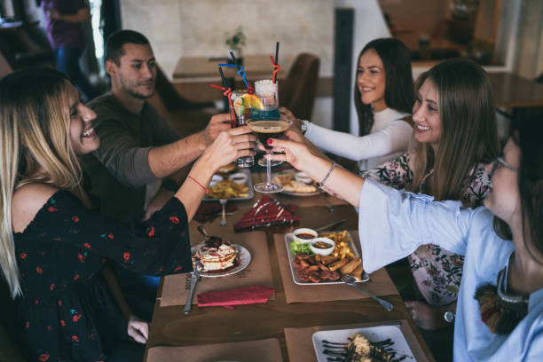 istock Cheerful friends at restaurant 1190558172