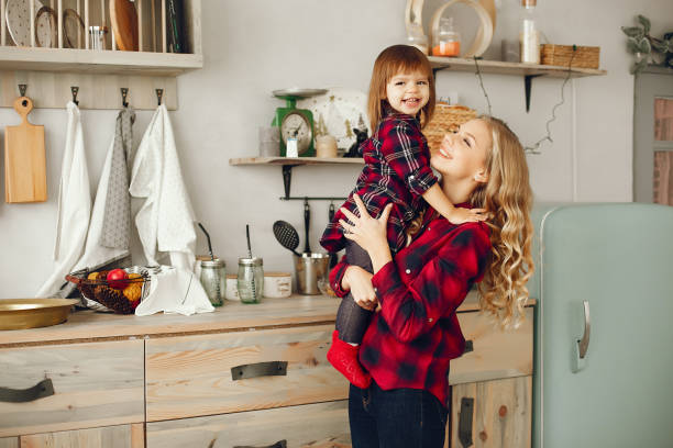 istock Mother with little daughter in a kitchen 1190558279