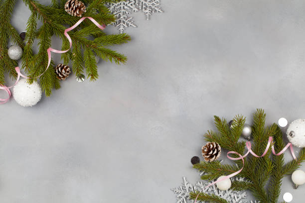 istock Christmas composition with christmas balls, tree branches snowflakes on blue background 1190559263