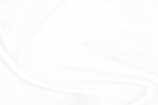 istock White cloth background abstract. Fabric is wrinkled and sofe wave. Material are used in textile assembly. 1190560656