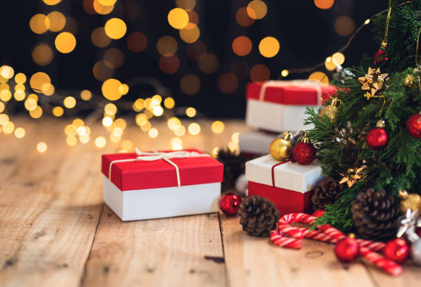 istock Christmas gift- Pine cones and branches  On the wood- 1190561187