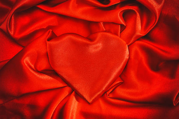 istock Heart shaped red silk background Love Valentines Day 1190561979