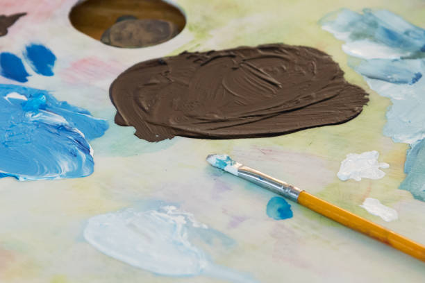 istock Painting brushes and colors 1190564252