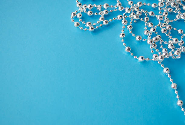 istock Decorative frame. Blue background with festive garland, flat lay. 1190566911