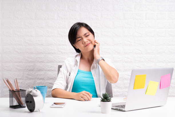 istock Woman scratching her skin at office 1190567361