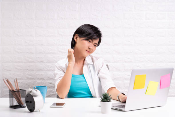 istock Woman scratching her skin at office 1190568245