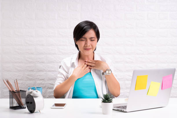istock Sick woman at office with fever 1190568544