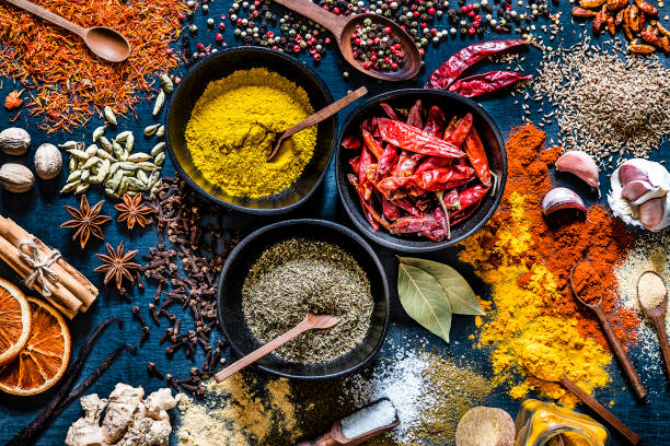 istock Various kinds of multicolored spices on a dark grey backdrop 1190568803