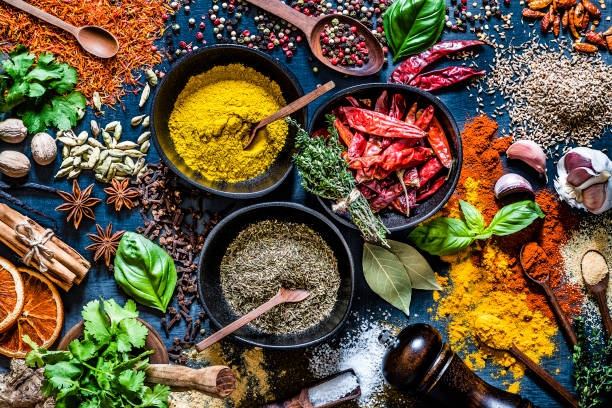 istock Various kinds of aromatic herbs and multicolored spices on a dark grey backdrop 1190568805