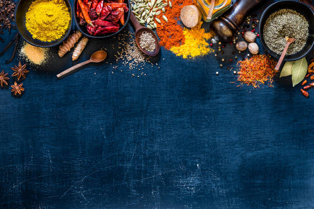 istock Various kinds of multicolored spices on a dark grey backdrop 1190568823