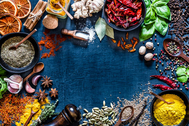 istock Various kinds of aromatic herbs and multicolored spices on a dark grey backdrop 1190568824