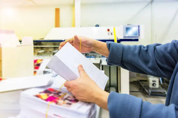 Photo of Manipulating envelopes for mailing