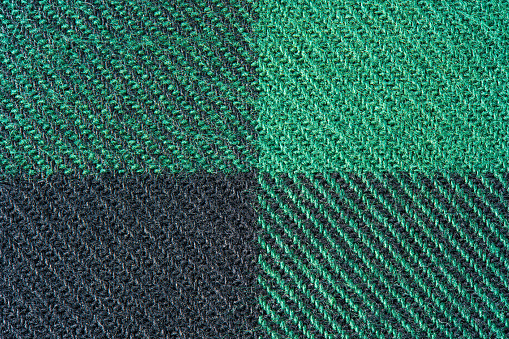 Black and Green Fabric in a Cage. Blanket Material. Clothes Background