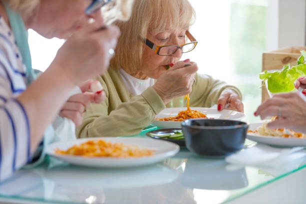 istock Senior woman having spagetti for lunch 1190573432