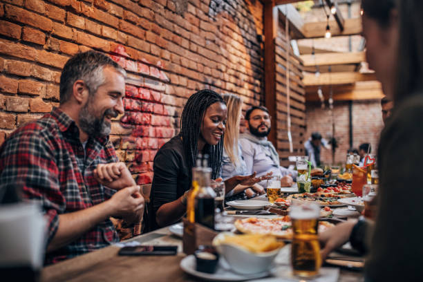 istock Friends sitting outdoors in pub together 1190575753