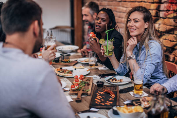 istock Friends sitting outdoors in pub together 1190576102