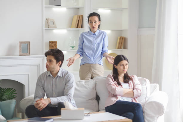 istock Professional therapist working with fighting young couple 1190578290