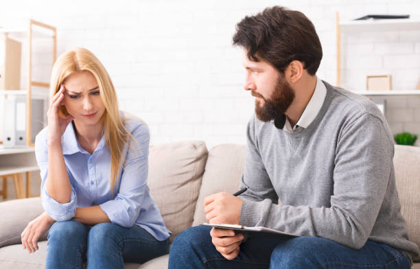 istock Sad woman awaring her problems at psychological consultation 1190579012